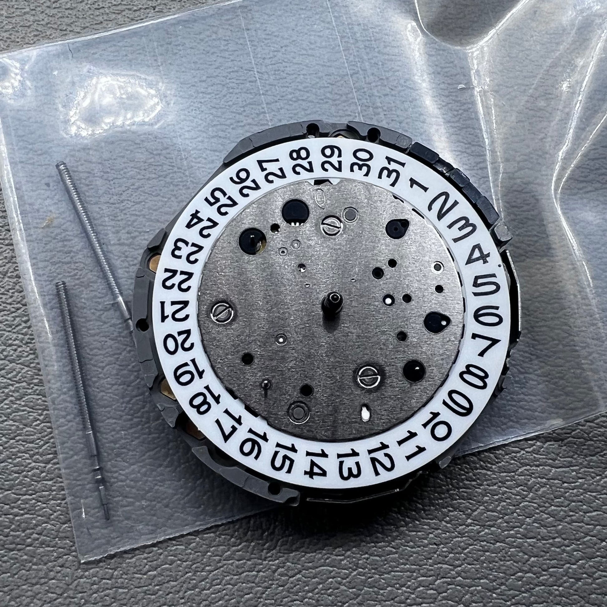 Japan Miyota JS26 watch quartz movement with date at 3 o'clock and small seconds at 6 and 9 markers
