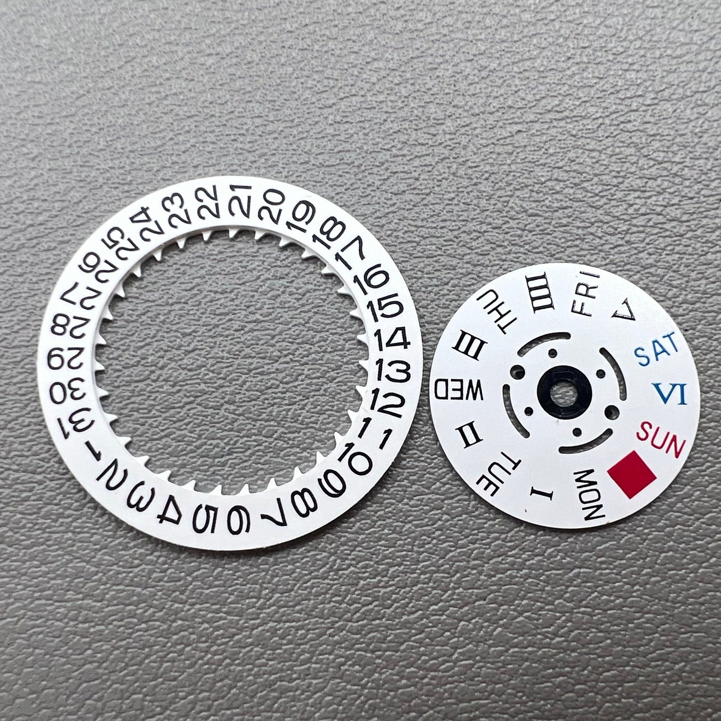 White date display with Roman and English weekday wheel for NH36 movement, crown at 3 o'clock.