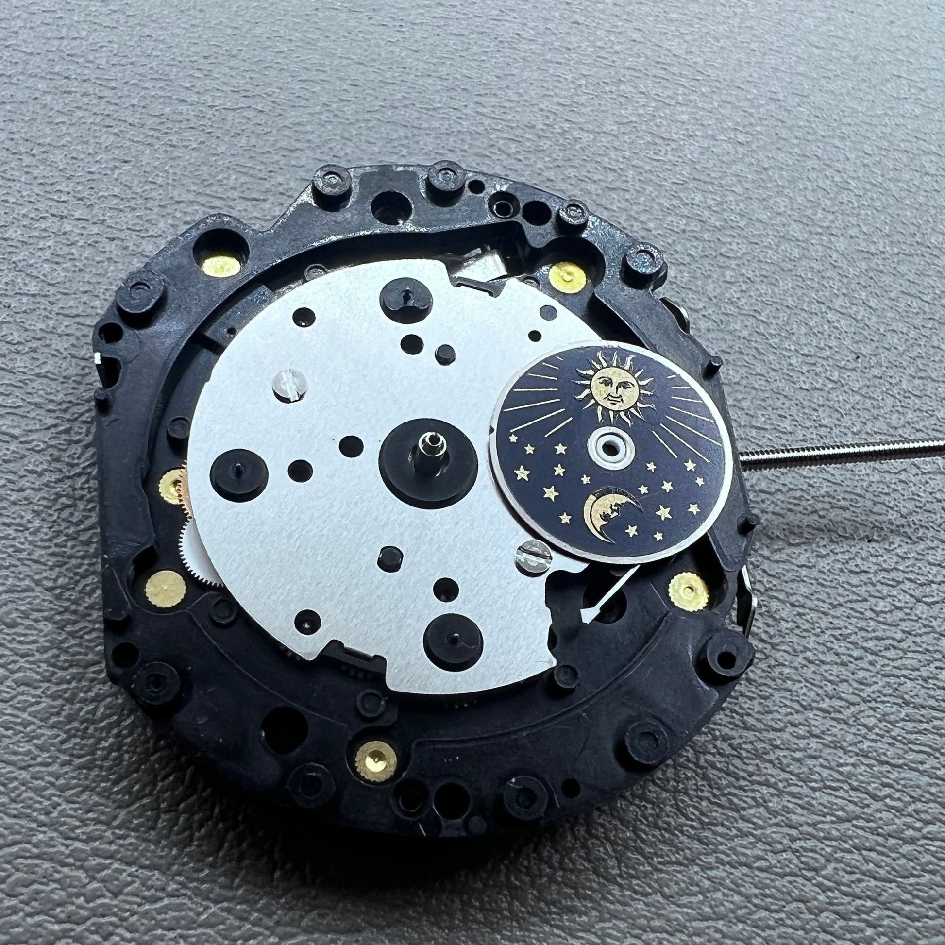 Original Japan VD59 watch movement close-up showing multifunctional quartz small second at 6/9/12 o'clock positions.