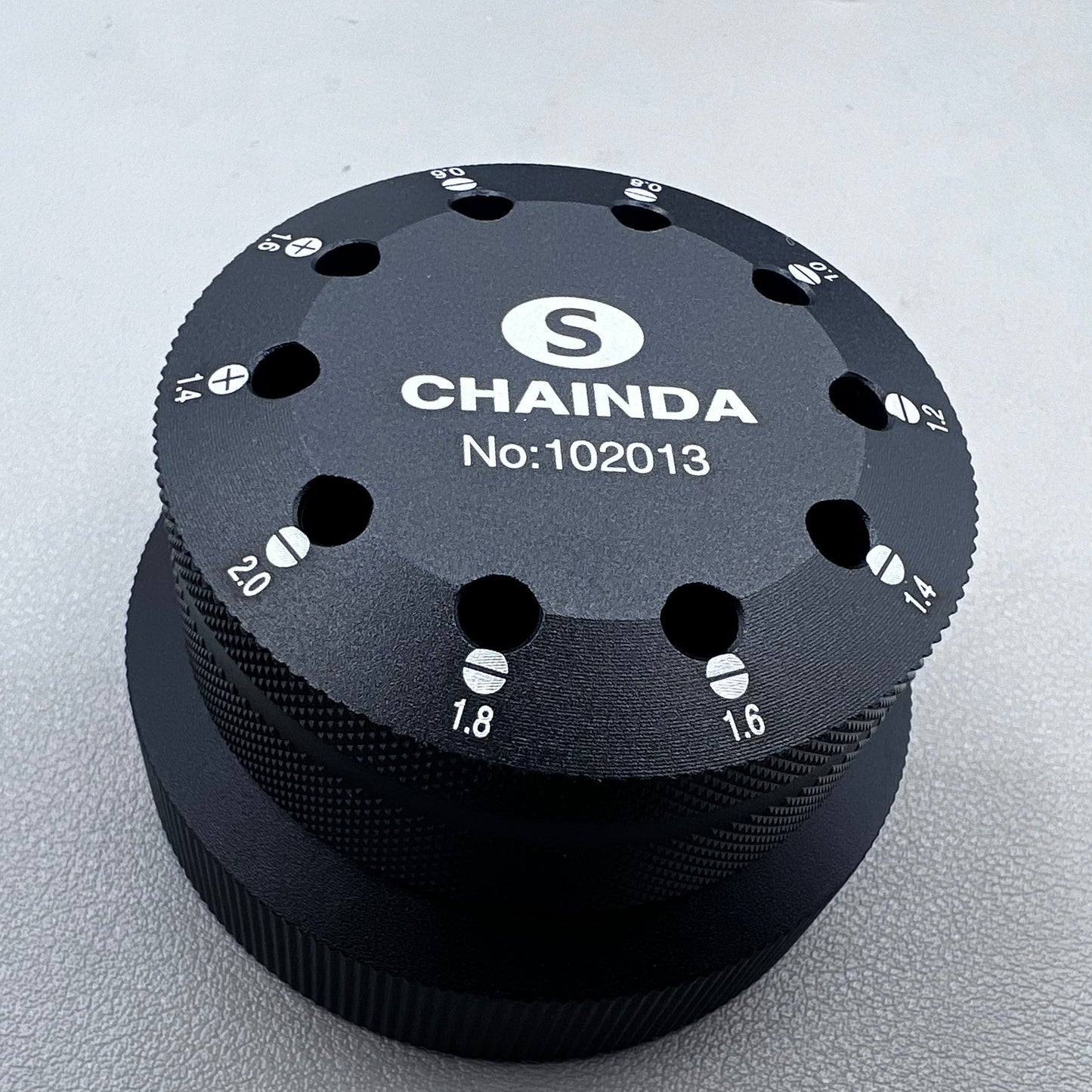 Black rotating stand with 10 slots for 0.6-2.0mm watch screwdrivers, organized storage solution.