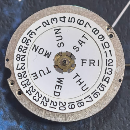 Swiss Made ETA1219 CAL1219 mechanical watch movement with white calendar display for precision timekeeping.