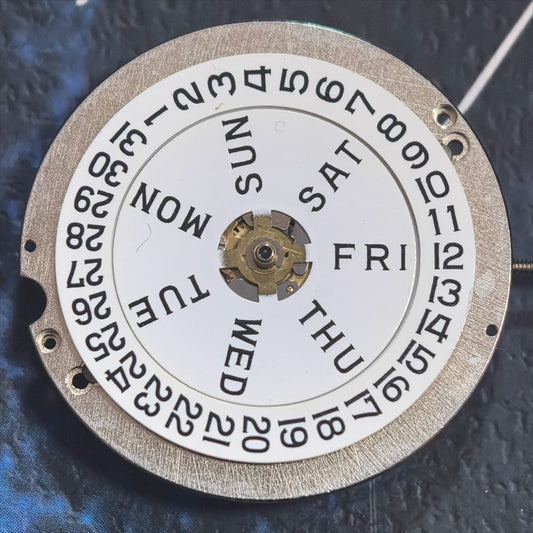 Swiss Made ETA1219 CAL1219 mechanical watch movement with white calendar display for precision timekeeping.