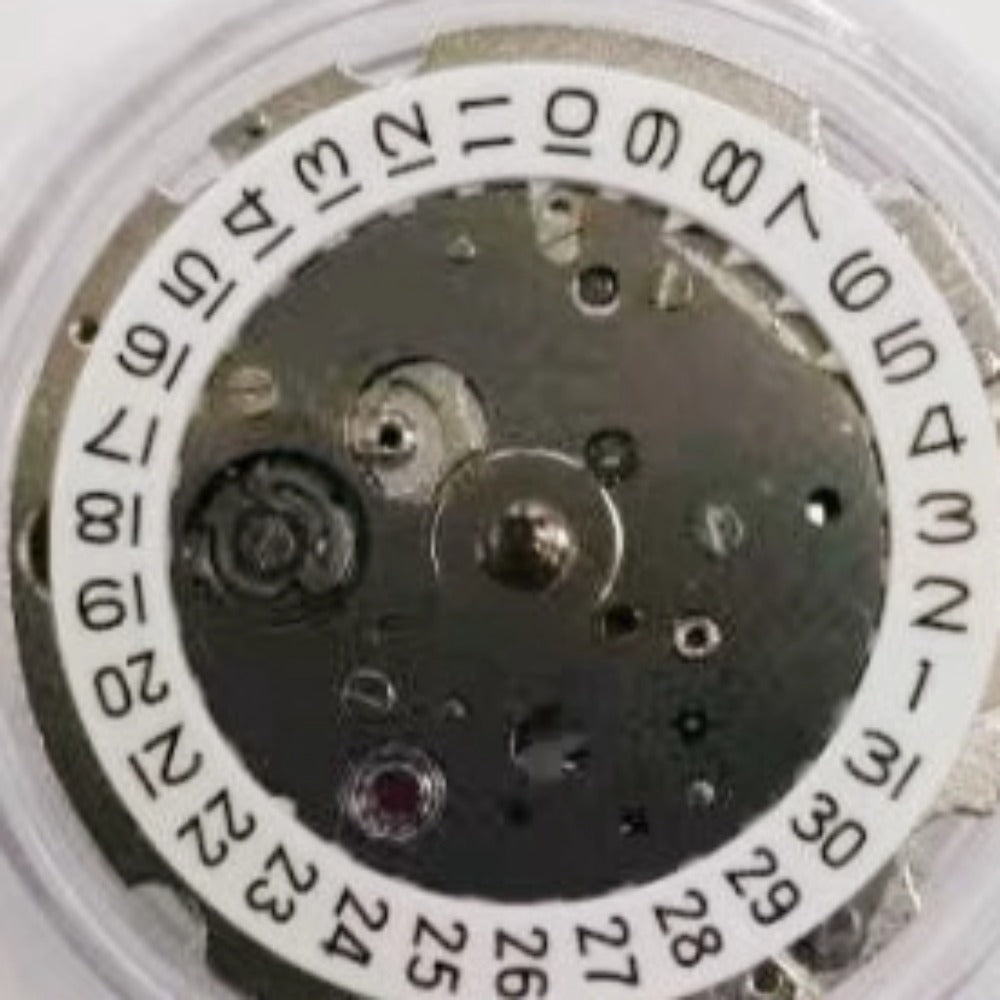 Original Japan Made 8218 automatic watch movement with small second subdial at 4.5, precise timekeeping mechanism.