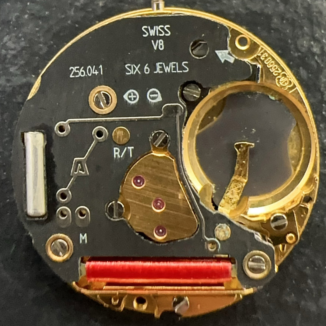 Swiss Made ETA256.041 quartz movement watch part with black dial and date at 6, ideal for repairs.