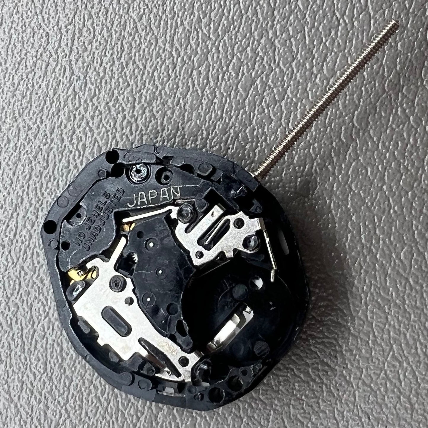 Japan PC23A Quartz watch movement showing 3 hands and double calendar functionality for precise timekeeping.