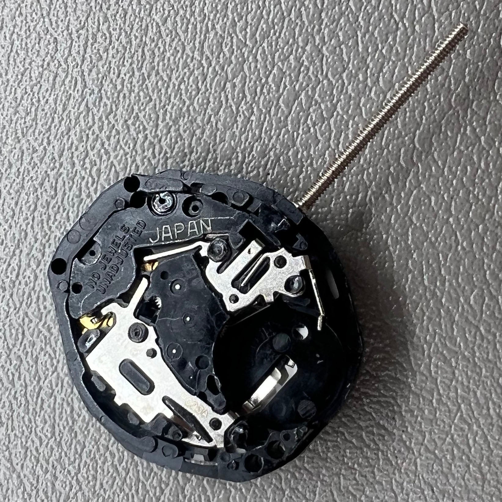 Japan PC23A Quartz watch movement showing 3 hands and double calendar functionality for precise timekeeping.