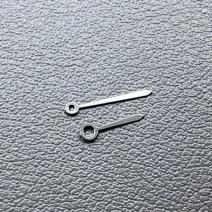 Set of 2 silver 10x7mm watch hands for Ronda 763/762/751/1062/1063 movements, perfect for repairs.