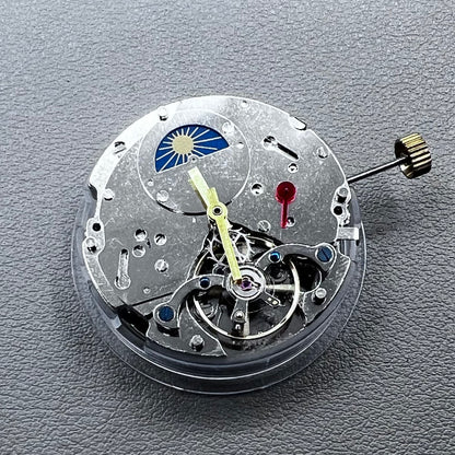 Silver Asian Dandong automatic watch with mechanical movement, date and week indicators, moon phase display.