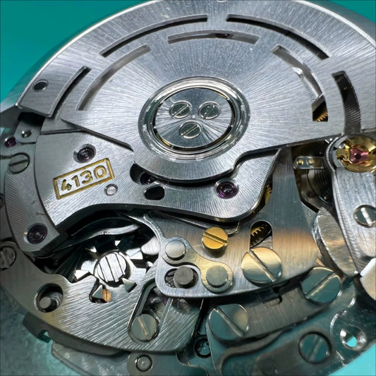 China Made 4130 mechanical watch movement with 6 hands, no calendar, Daytona style, blue hairspring detail.
