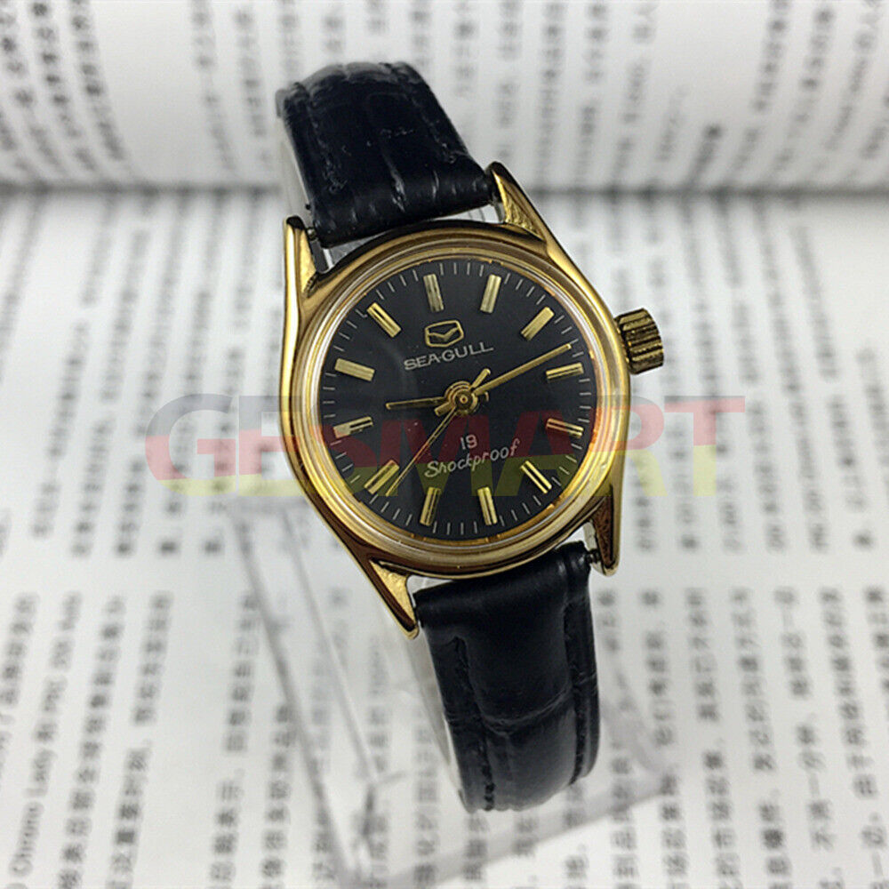 Tianjin Seagull black round case ladies watch with gold nail markers and manual mechanical movement.