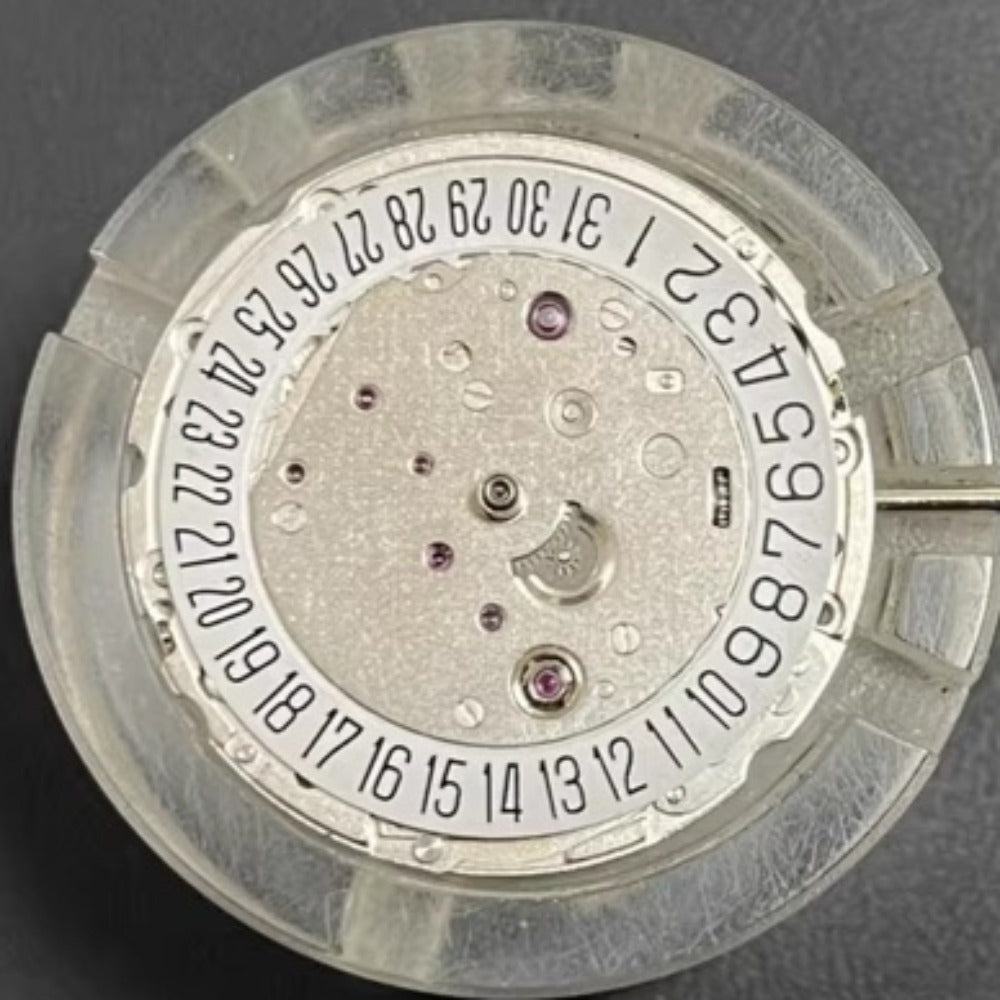 Asian 7750 automatic chronograph movement showing day and date at 3 o'clock, ETA 7750 style.