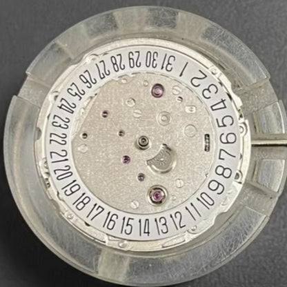 Asian 7750 automatic chronograph movement showing day and date at 3 o'clock, ETA 7750 style.