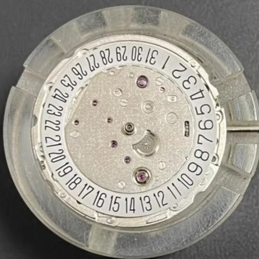 Asian 7750 automatic chronograph movement showing day and date at 3 o'clock, ETA 7750 style.