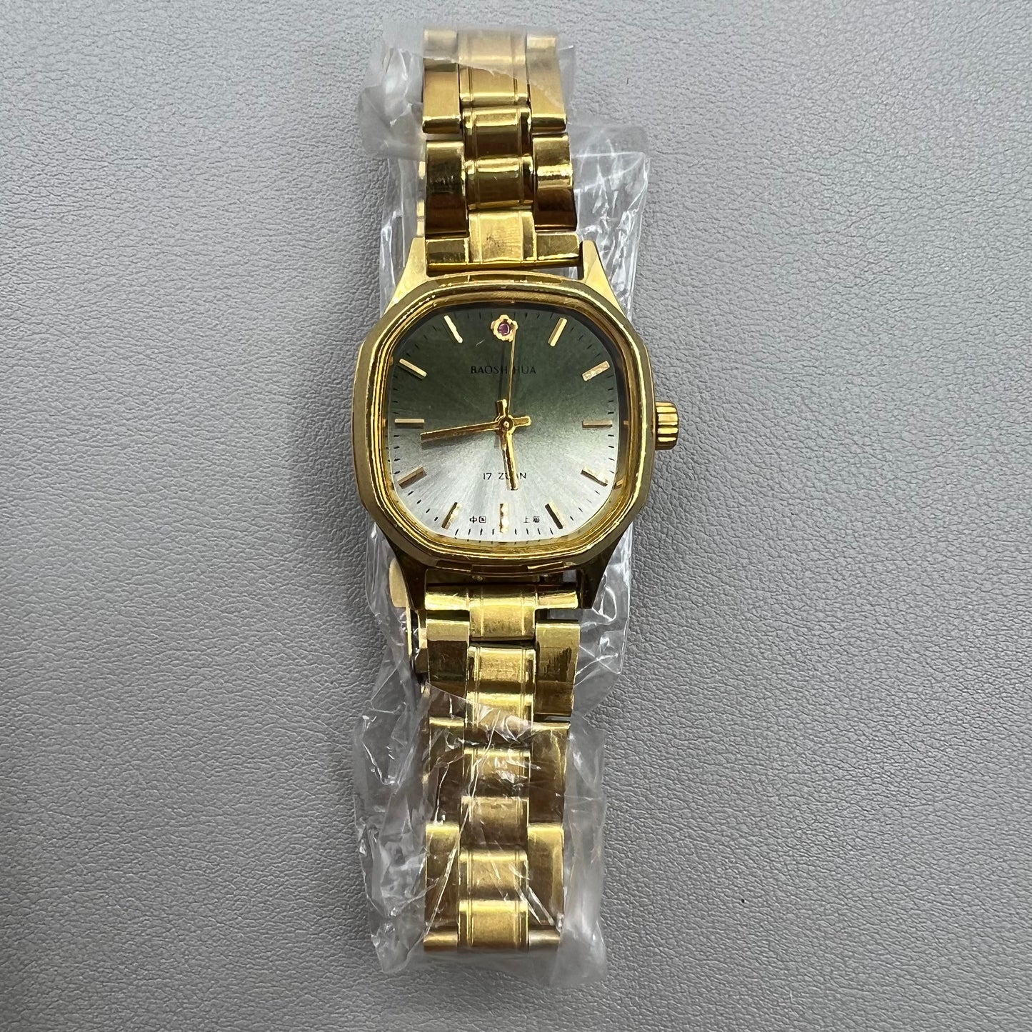 Shanghai 33mm manual mechanical watch with golden nail square case, 17 jewels, elegant design.