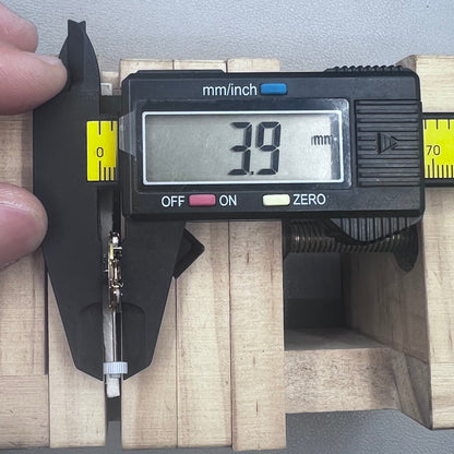 Swiss Ronda 775 quartz watch part with white date disk at 6 o'clock, ideal for precise repairs.