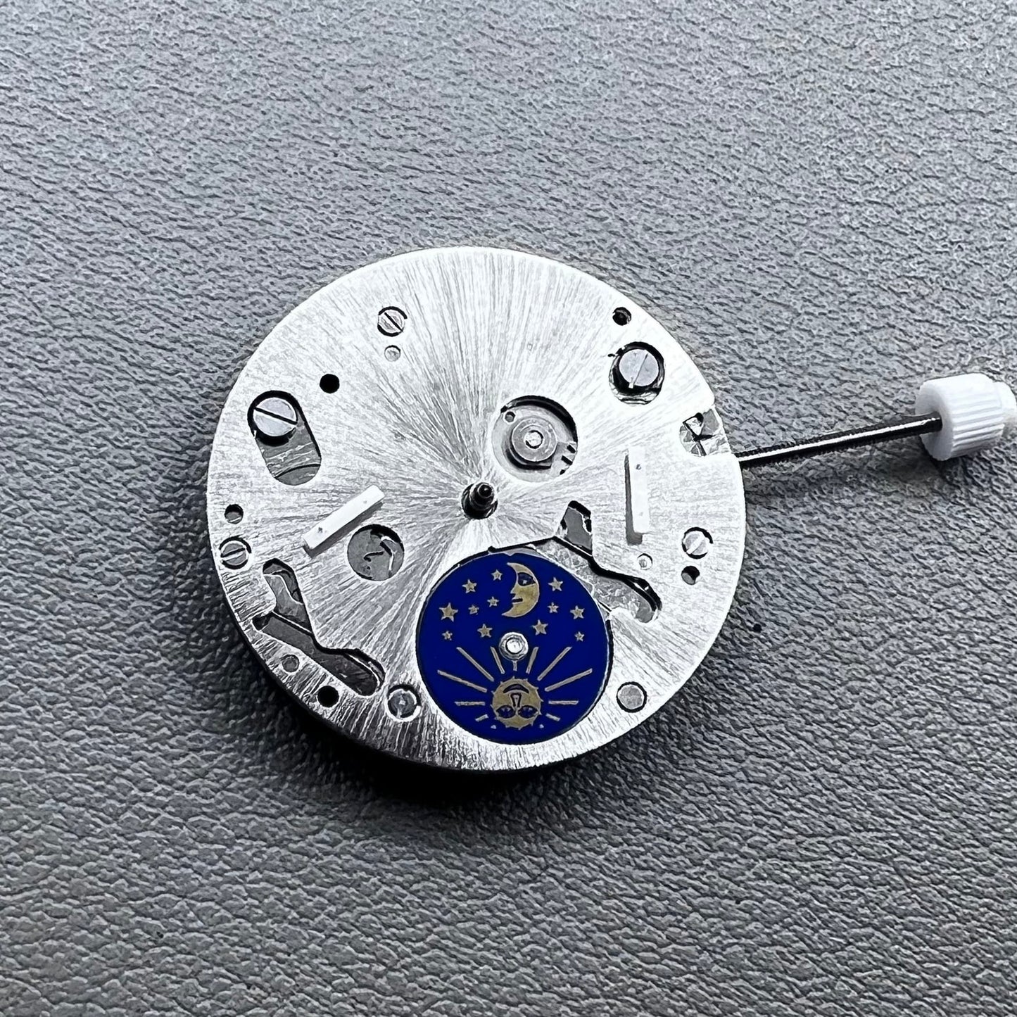 Swiss ISA 9231 Quartz watch movement with star moon phase display at 6 o'clock, precision craftsmanship.