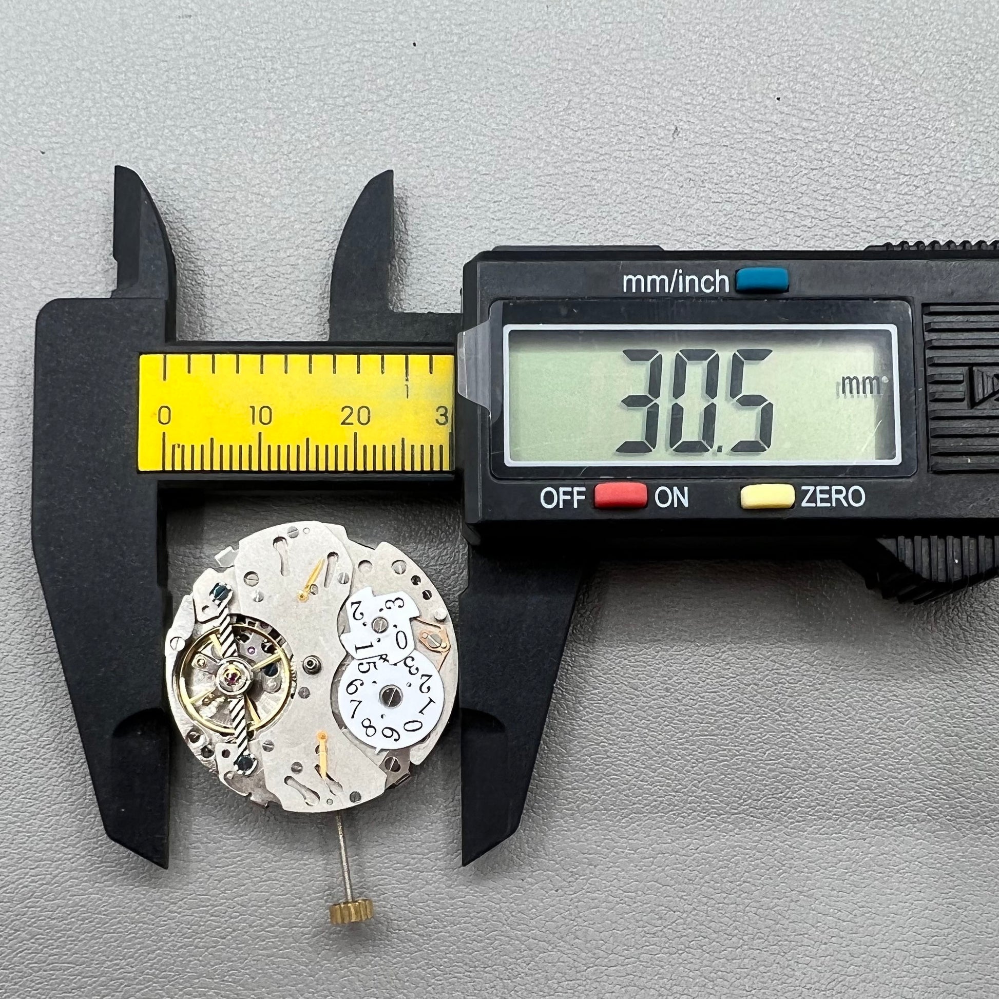 Wenzhou Mechanical watch movement with bare balance wheel and big date display at 12 o'clock.