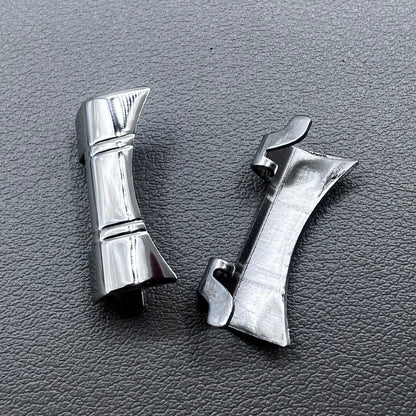 Set of 2 silver steel curved end links with spring bars for 24x12mm watch bands, enhancing bracelet fit.