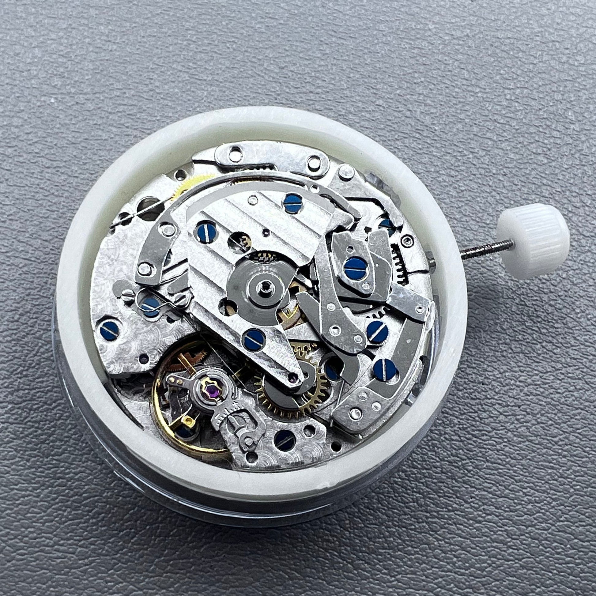 Close-up of Chinese 7750 automatic chronograph movement with day date at 3, ETA 7750 style mechanism
