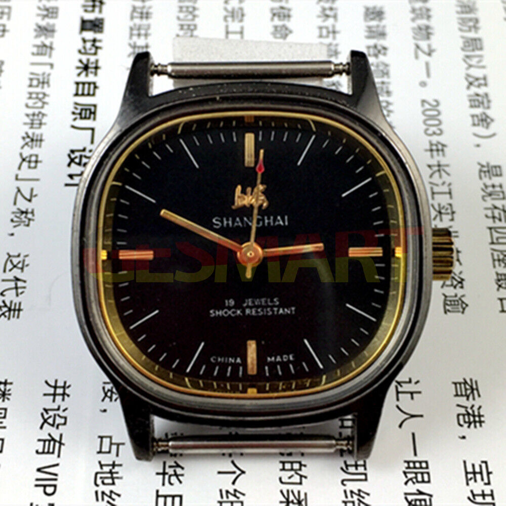 Shanghai Factory 34mm manual mechanical watch with black dial, 19 jewels, shock-resistant design.
