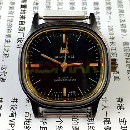 Shanghai Factory 34mm manual mechanical watch with black dial, 19 jewels, shock-resistant design.