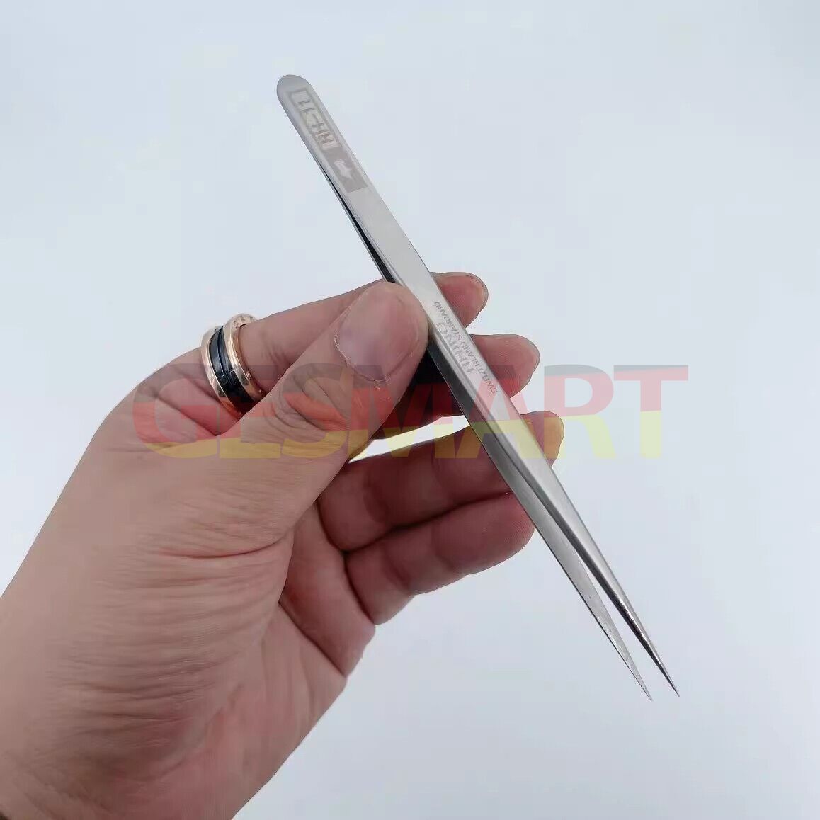 Japanese made stainless steel tweezers for precise watch battery replacement and repair.