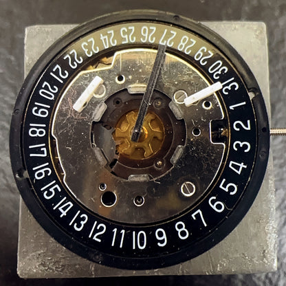 Swiss Made ISA 8271 watch part featuring black disk, multifunctional quartz movement for precision timekeeping.