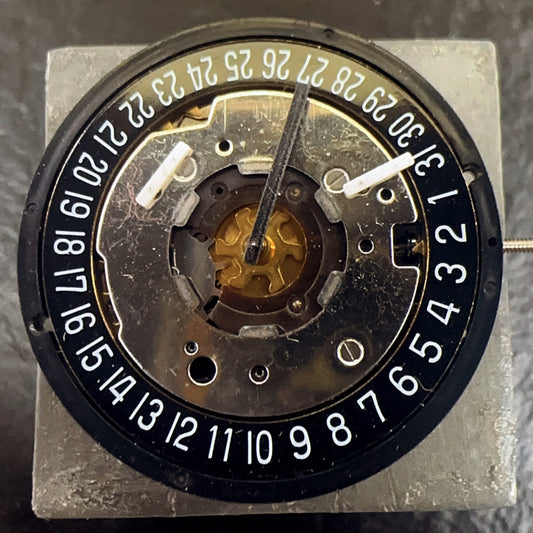 Swiss Made ISA 8271 watch part featuring black disk, multifunctional quartz movement for precision timekeeping.