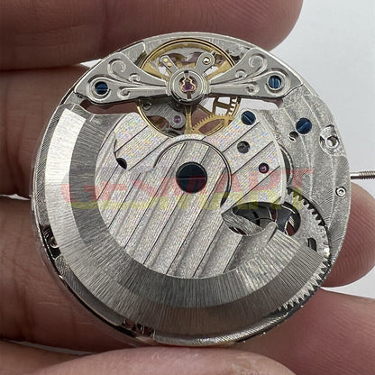 Double Mainspring hollow mechanical watch movement displaying dual time zones with intricate gears and precision craftsmanship.