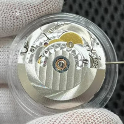 Close-up of Asian 7750 automatic chronograph movement with day date display at 3 o'clock for precise timekeeping.