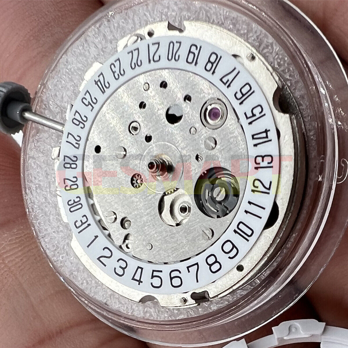 Miyota/Citizen 8215 silver plated automatic watch movement showing date at 6, precision Japanese mechanics