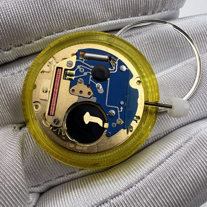 Swiss Made ETA 955.122 quartz watch movement with double calendar and three hands for accurate time and date display.