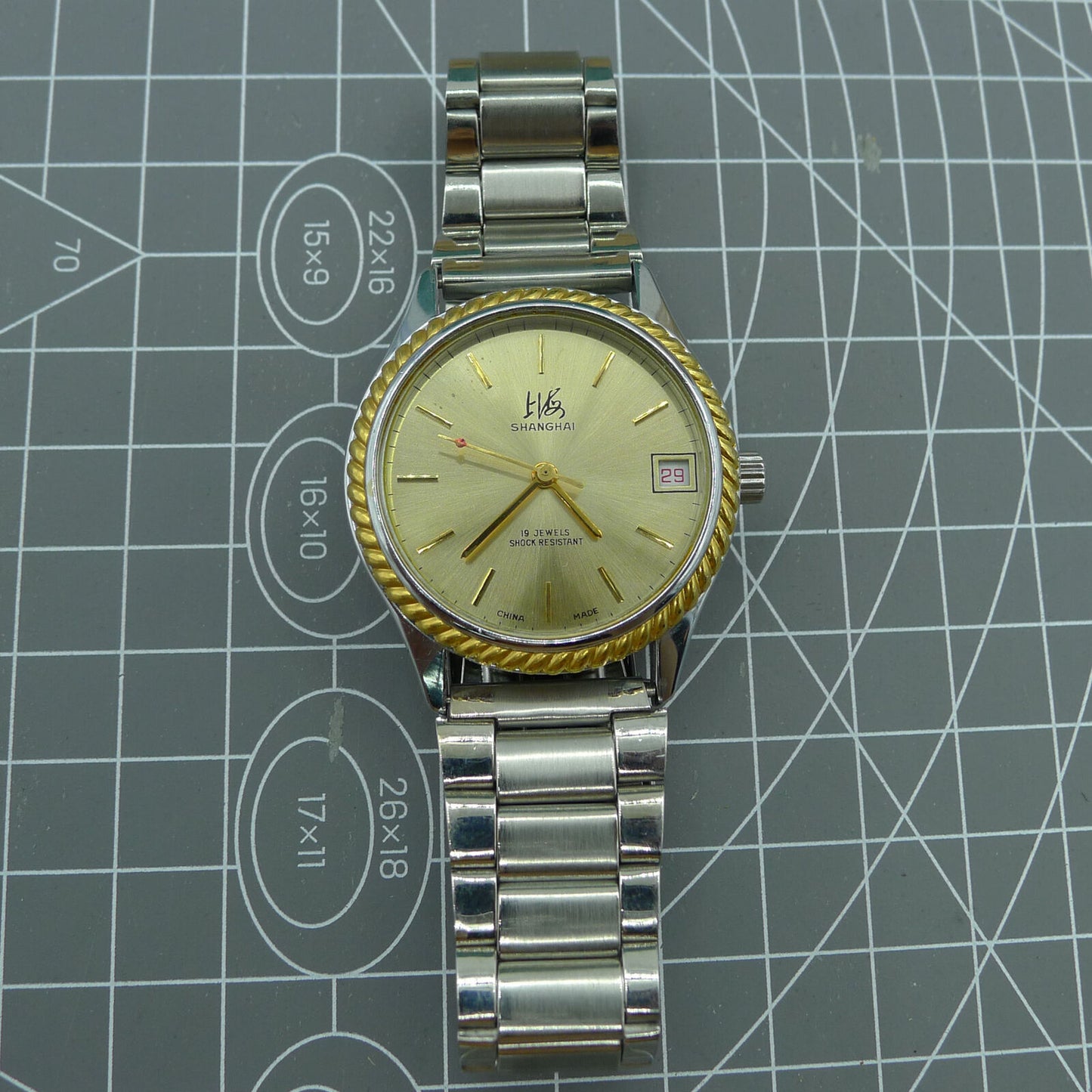 Shanghai Factory 36.5mm manual mechanical watch with 19 jewels, shock-resistant, classic design for everyday wear.