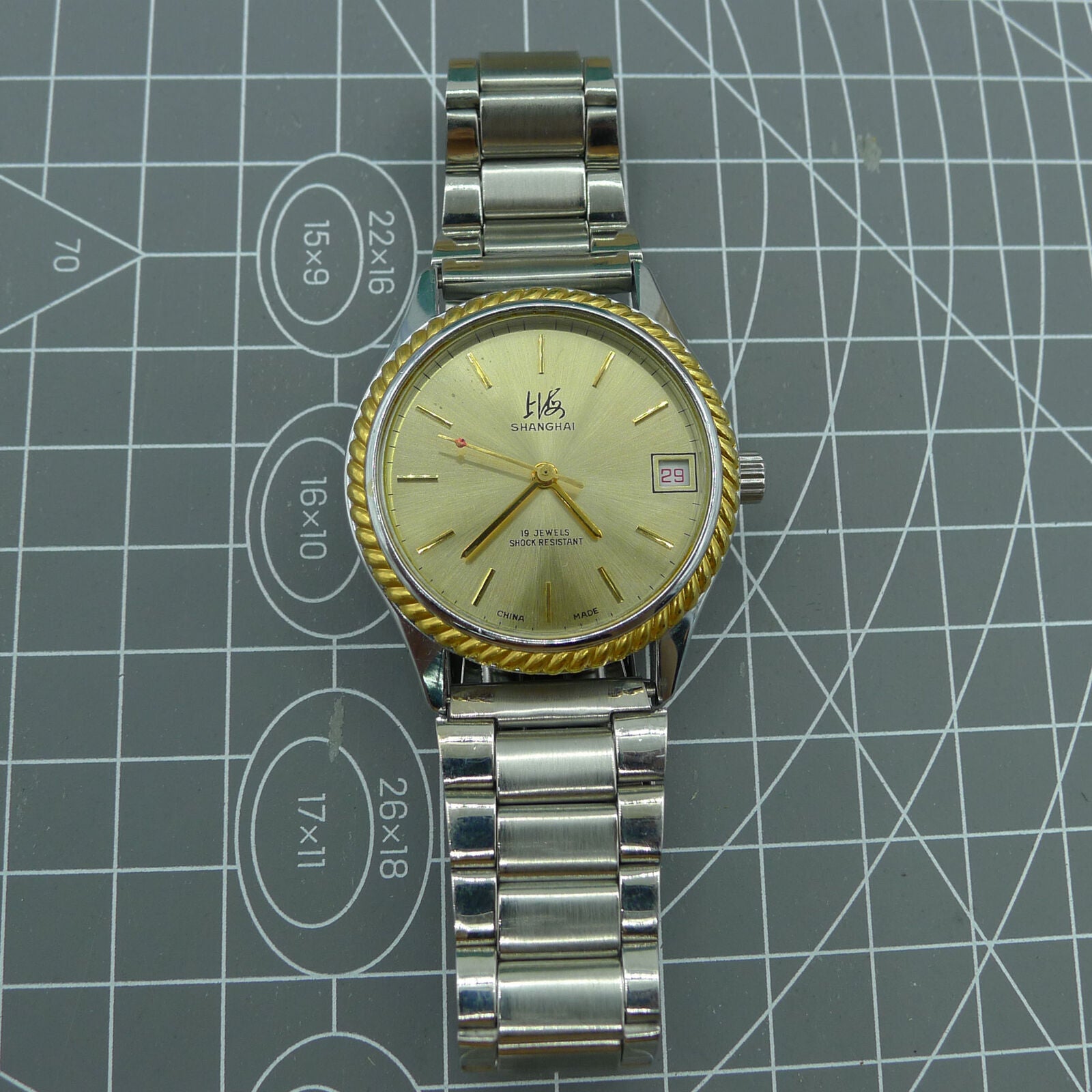 Shanghai Factory 36.5mm manual mechanical watch with 19 jewels, shock-resistant, classic design for everyday wear.