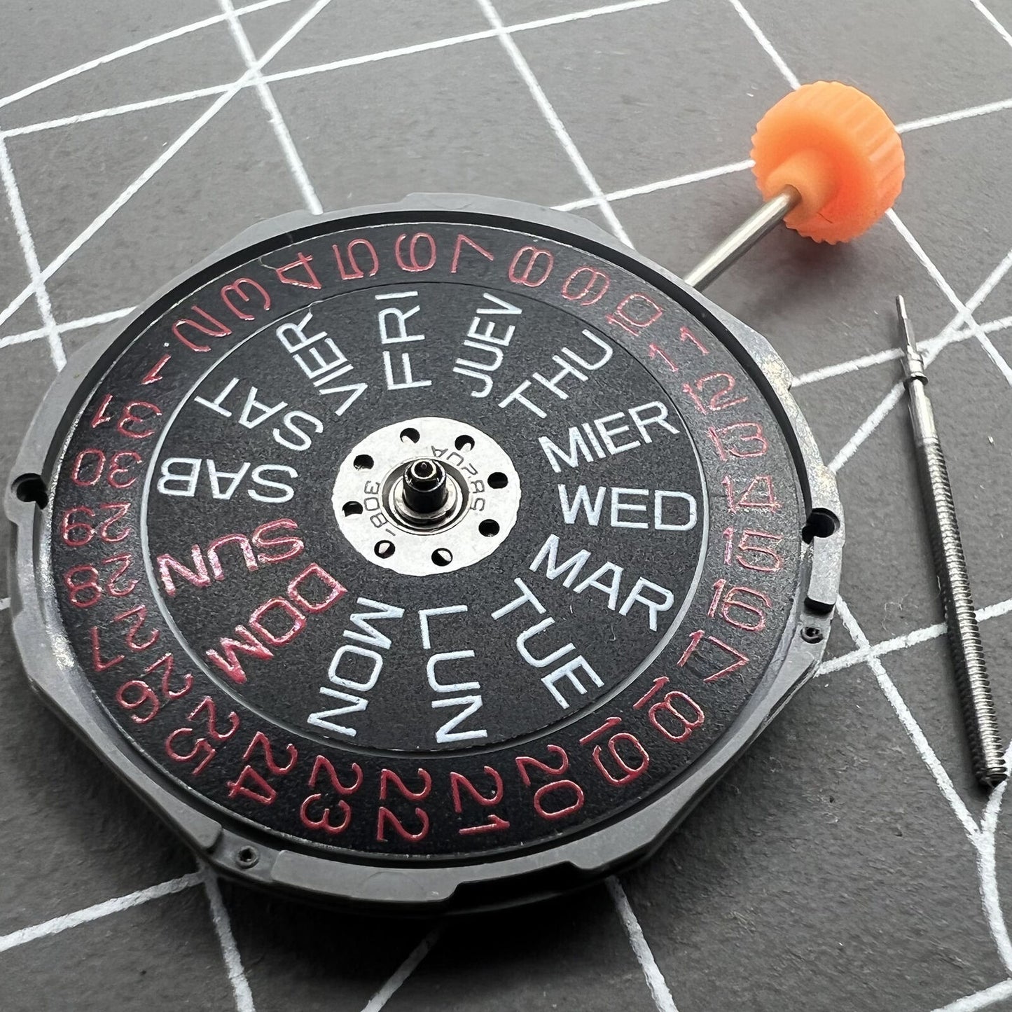 Miyota 1M02 quartz movement with black dial, red font, double calendar for watch accessories.