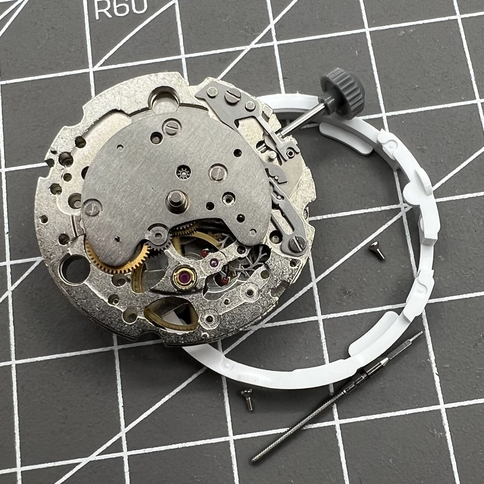 Miyota/Citizen 82S7 silver plated automatic watch movement for precise mechanical performance.