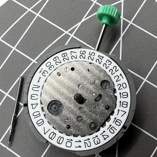 Miyota FS26 chronograph quartz watch movement with date at 4.5, precision Japanese craftsmanship.