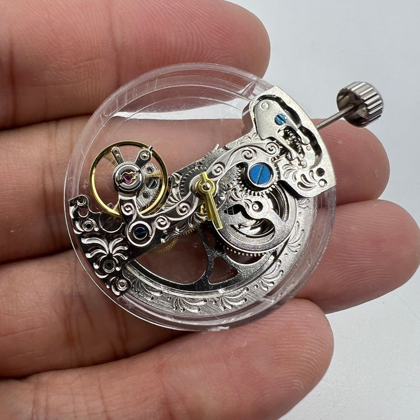 Silver long pendulum wheel watch accessory by Asian, showcasing intricate automatic mechanical movement design.