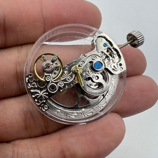 Silver long pendulum wheel watch accessory by Asian, showcasing intricate automatic mechanical movement design.
