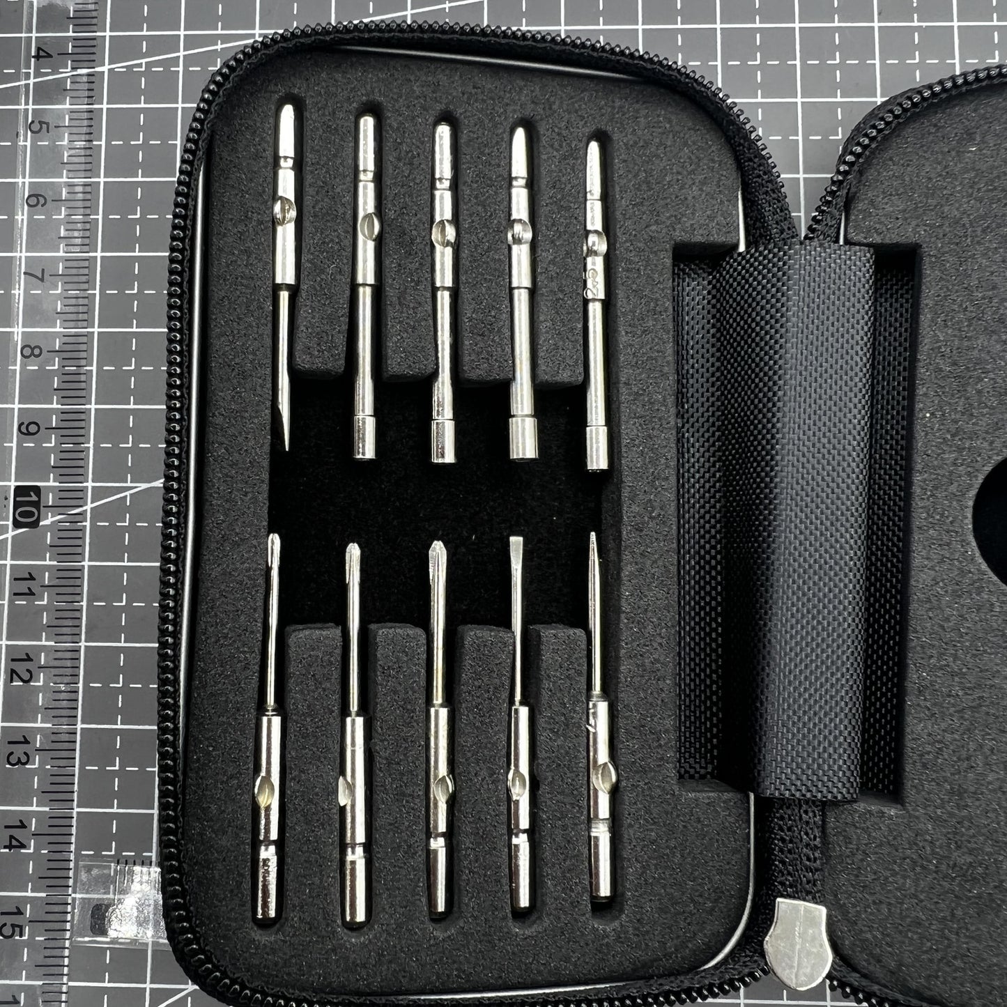 Precision screwdriver set with hex tools for watches and glasses repair, ergonomic grip.