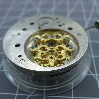 Multifunctional automatic watch, kinetic tourbillon luxury timepiece with mechanical movement details.