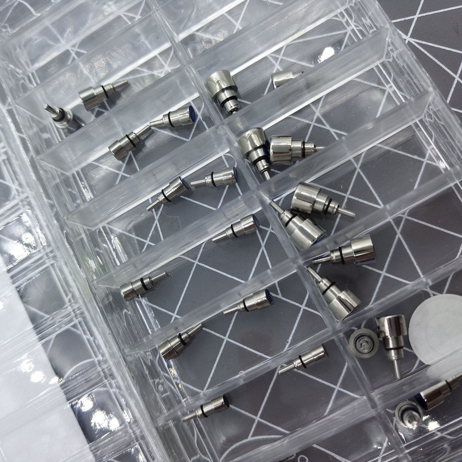 Classic stainless steel chronograph button set with 26 screw-in pushers for precise watch repair and customization.