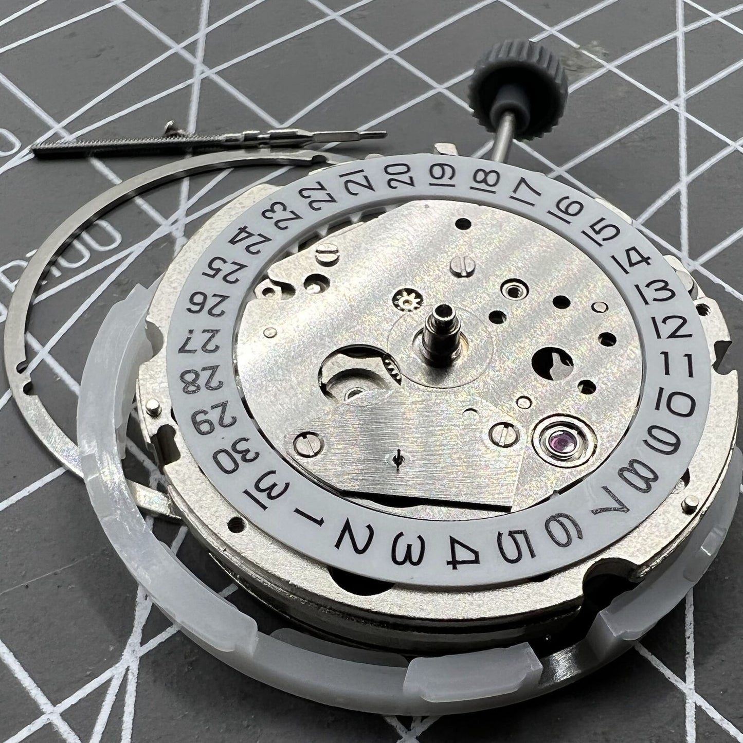 Miyota 8217 automatic watch movement showing 3 hands with small second at 9 o'clock position.