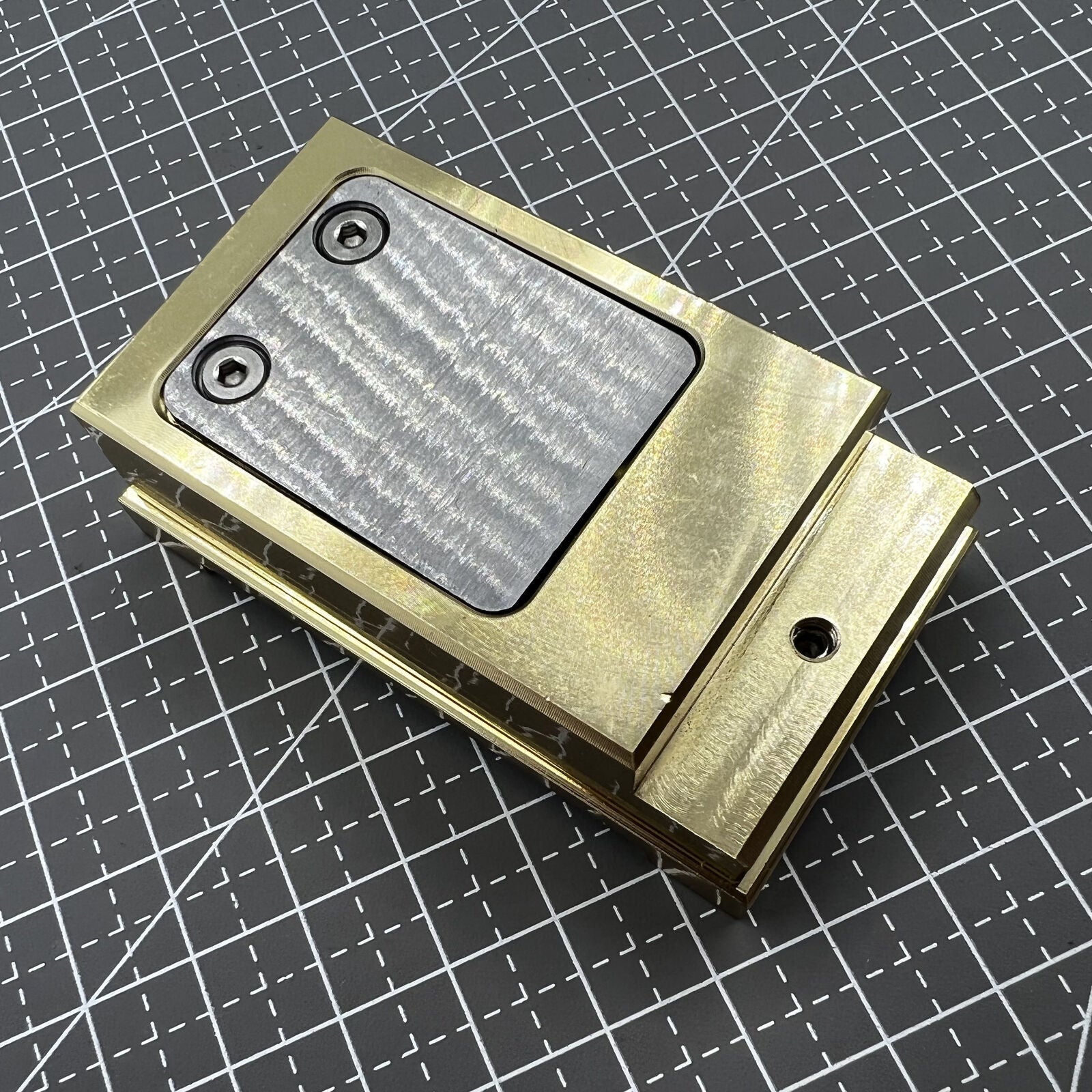 Brass-handled stainless steel pegwood tool by Woodcutter for precise watch cleaning and detailing.