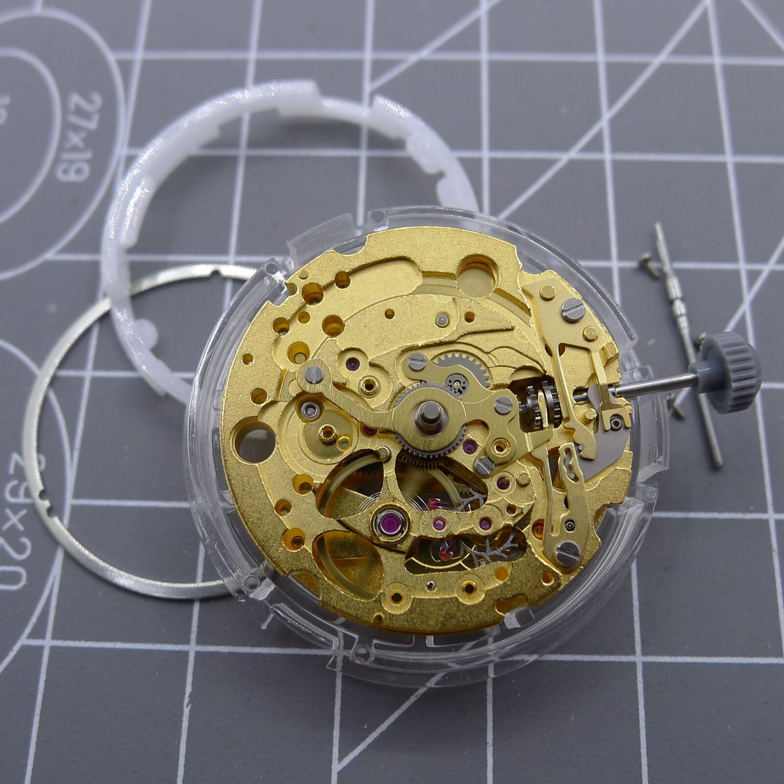 Gold-tone mechanical watch movement by Miyota (CITIZEN) 82S0, showcasing automatic precision engineering.