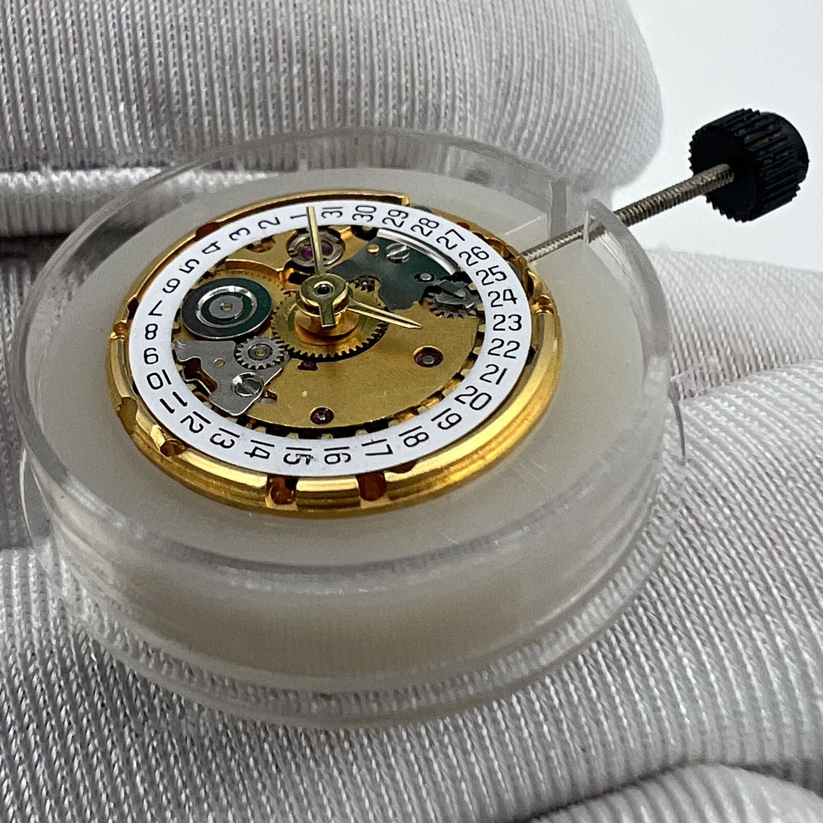 Golden ETA2671 mechanical watch movement with date display at 3 o'clock, ideal for replacements.