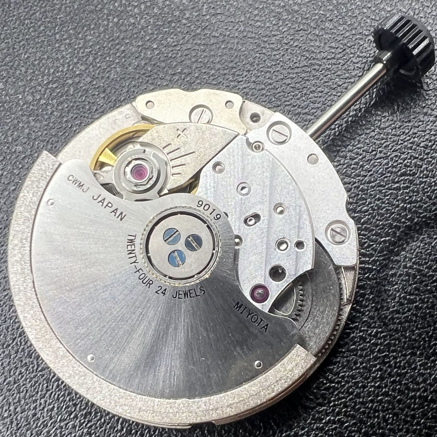 Miyota/Citizen 9019 automatic watch movement with dual date windows at 3 and 6, Japan made.