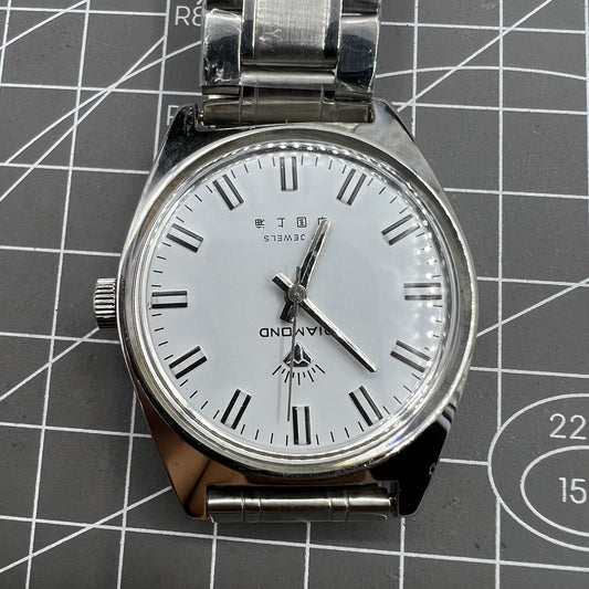 38mm Shanghai Diamond manual watch with white dial, silver case, 17 jewels for precise timekeeping.