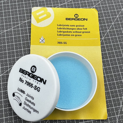 Swiss Bergeon 7055-SG watch lubricant seals box with two silicone grease foam pads for accessories.