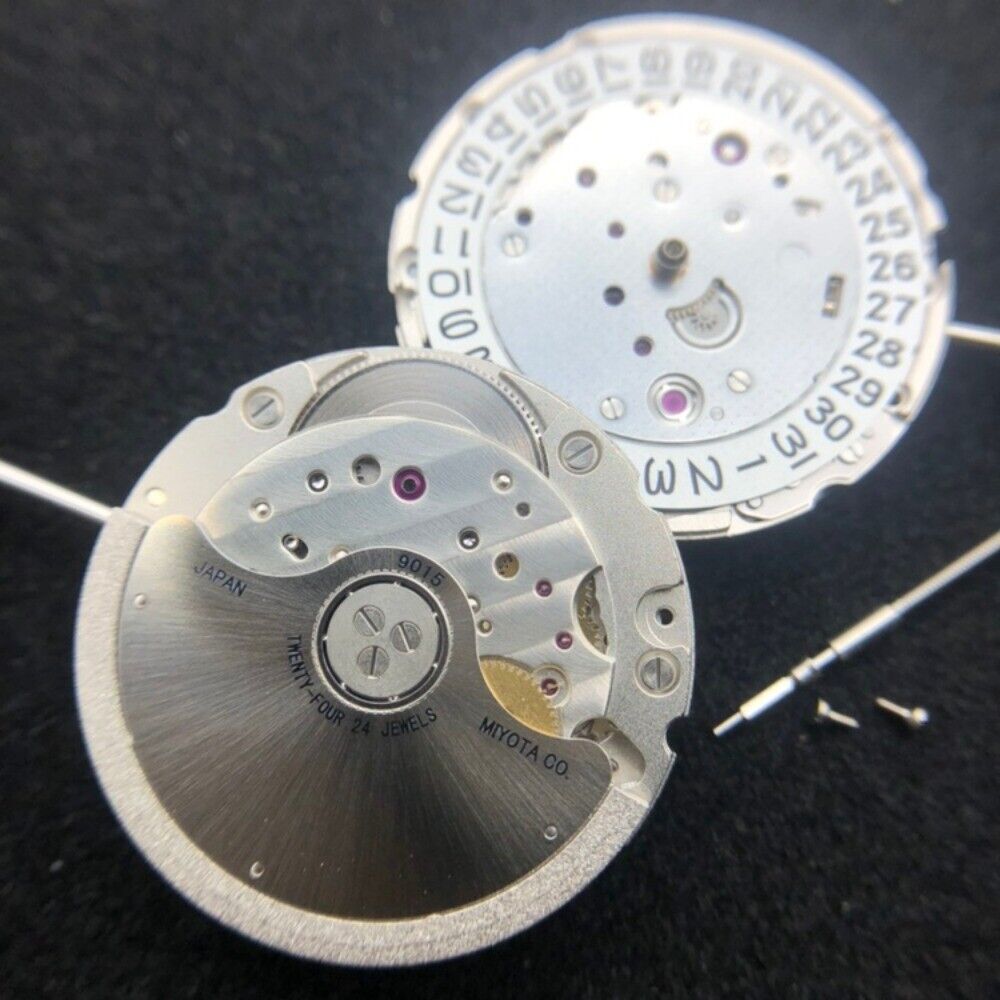 Miyota Citizen 9015 automatic watch movement with date display at 3 and 6 o?clock positions.